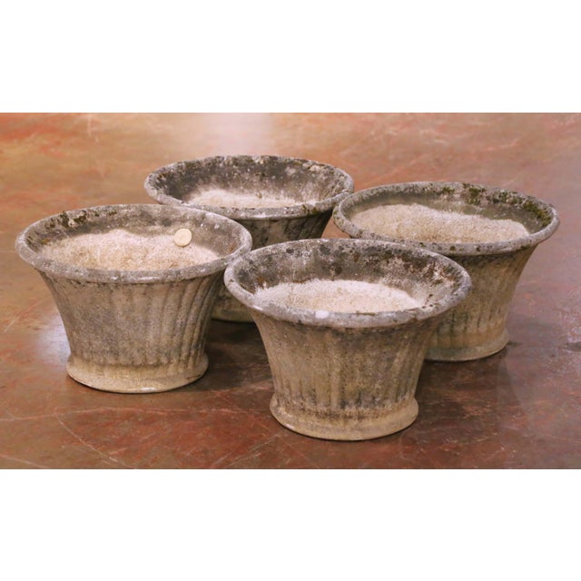 This set of four antique French garden planters was crafted in Normandy circa 1880 in cast stone, known in France as...