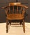 Late 19th-early 20th century set of 4 arm chairs, English. Low back tavern Windsors with well turned spindles, boldly...