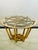Accent table or center table in the manner of Jean Royere. Wood frame with glass top. Measures 18 1/2” high with 32”...