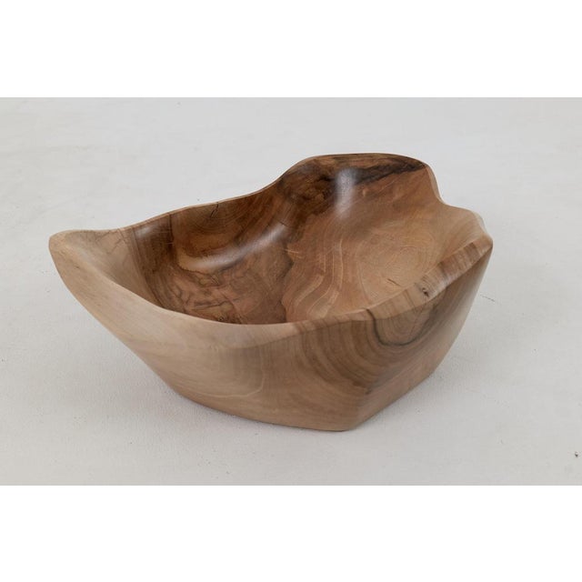 Elevate your home decor with our stunning carved walnut bowl, a true testament to artisanal craftsmanship. This bowl...