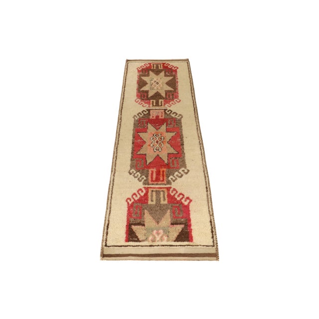 From Rug & Kilim’s vintage selections, a 3x11 hand-knotted wool runner uniquely marrying rich and forgiving hues in...