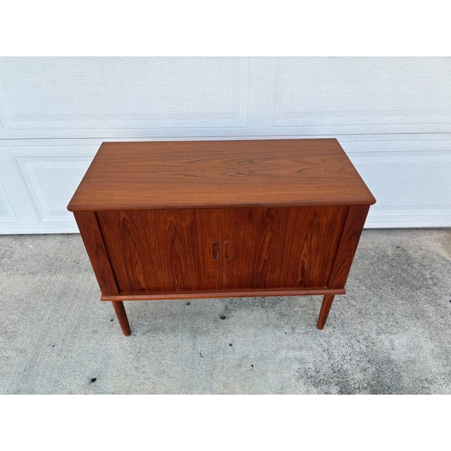 Danish Mid Century Modern Teak Tambour Door Jr. Credenza / Vinyl Storage Cabinet, c. 1960's. This beauty features perfect...