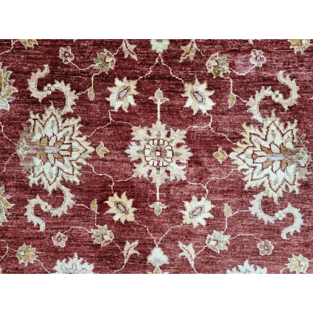 Bring home a piece of history with this Handmade Vintage Afghan Zigler Rug, a beautiful example of the traditional Afghan...