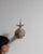 This 19th century candlestick from France is finished in antique white, worked in wood. Its form follows honest, well-...