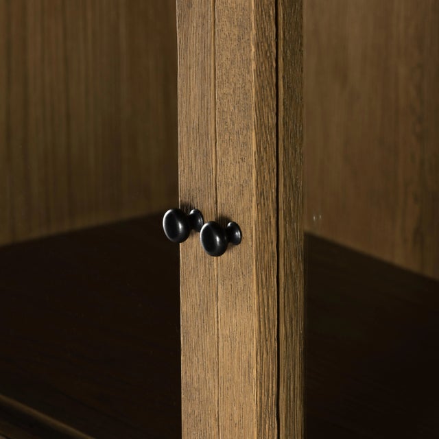 Glass doors allow for prized possessions to dazzle on full display while spacious interior drawers add out-of-view...