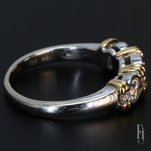 Here is an 18k Gold Three-Stone Ring featuring Three Round White Diamonds. The primary diamonds are each ~0.26ct, G color...