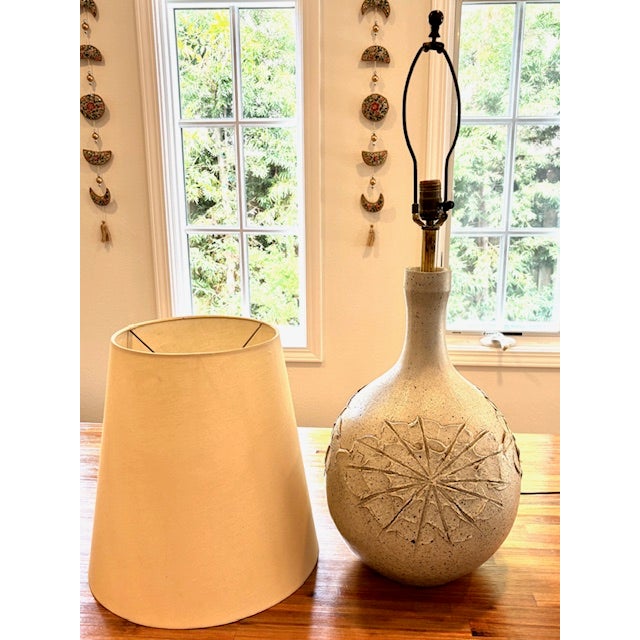 An exceptional and highly collectible David Cressey "Bubble Body" Sunburst ceramic table lamp, designed during the golden...