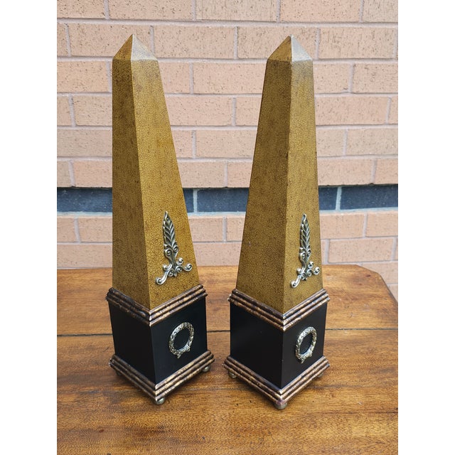 Pair Neoclassical Style Brass, Composition and Partial Ebonized and decorated Table Obelisks in great vintage condition....