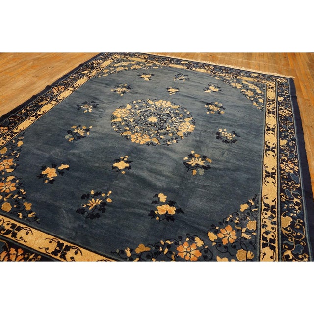 Wool Hand Knotted Pile Blue Rectangle 1920s Antique Rug, Circa Date: 1920s. This exquisite hand-knotted piece exemplifies...