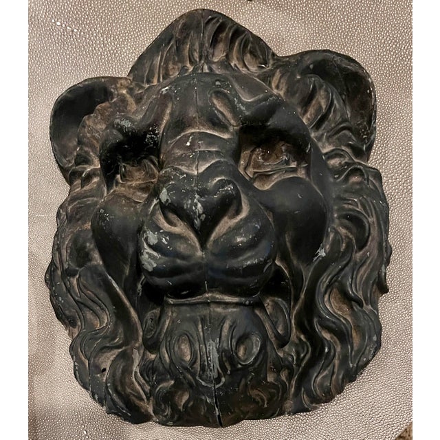 This antique zinc lion head architectural wall element brings bold sculptural presence and historic charm to any space....