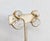 1980s goldtone pavé round clear rhinestones in the shape of twisted Ss clip earrings. Marked "GIVENCHY© PARIS NEW YORK" on...