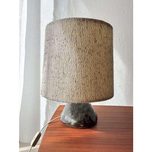 Characterful vintage table lamp made in the 1970s, with an organically shaped ceramic base. The base features an...