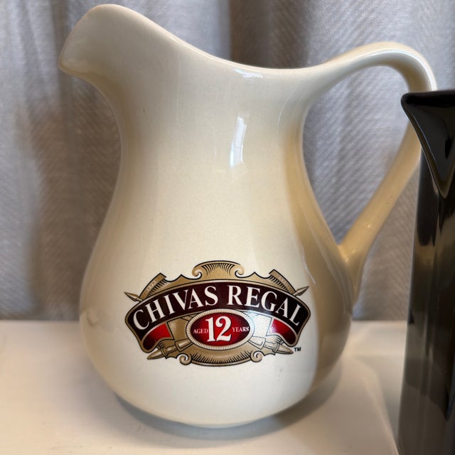 Set of three vintage advertising ceramic pitchers. Large Chivas: 7”x 4.5” x 7”H Canadian 4.5” W x 3”D x 6” H Bacardi 4.4”...