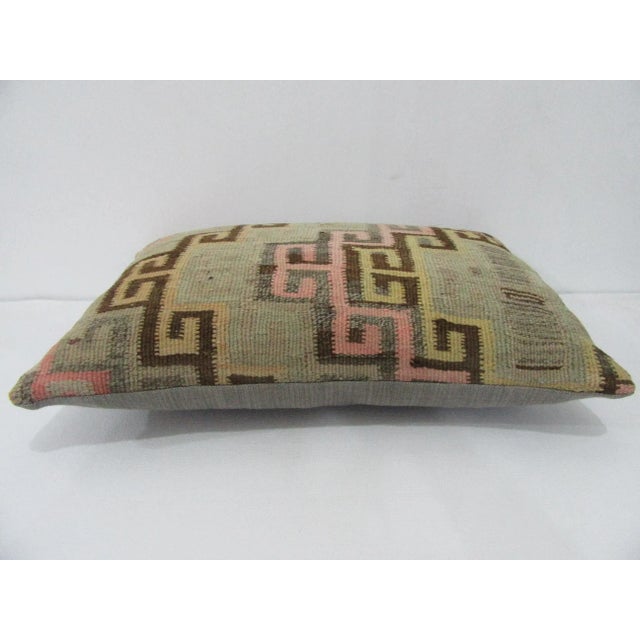 Handmade decorative pillow cover made from a vintage Turkish kilim rug. Backed with good quality cotton fabric. Pillow...