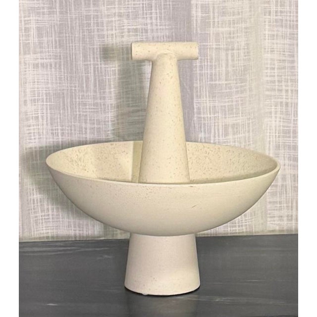 Elevate your space with this sculptural Champion Bowl by Studio A (Global Views) in a soft ivory finish. Featuring a...