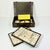 This is a lovely antique Mahjong Game Set. It features tiles that have bamboo backs with bone fronts. The tiles are...