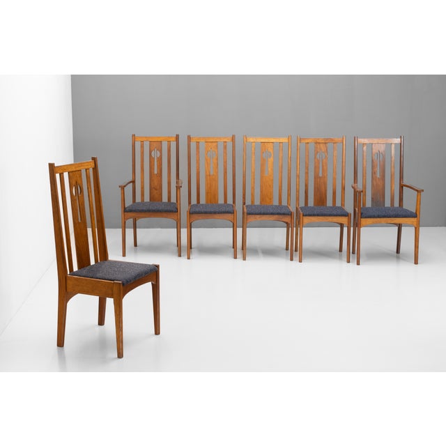 Set of six mid-century high back dining chairs in a Charles Rennie Mackintosh style. Re-finished and re-upholstered. Wear...
