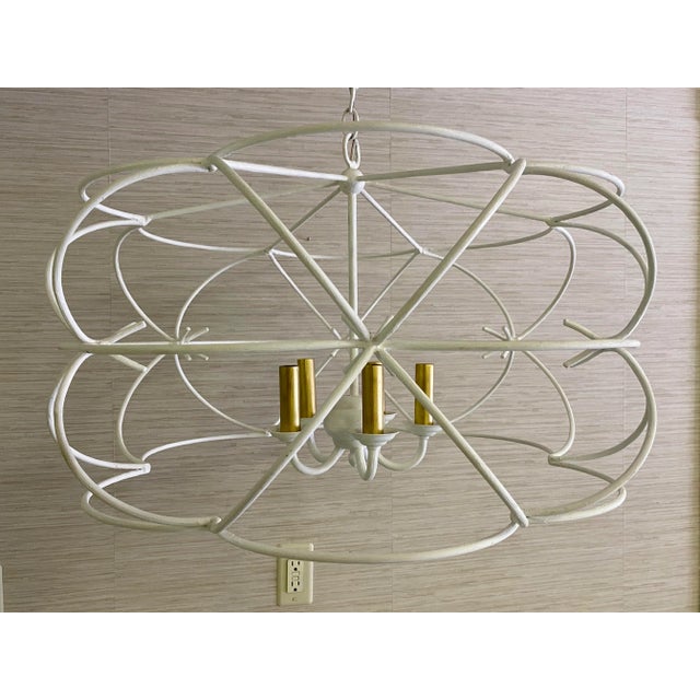 I just can’t stop looking at this unique chandelier. Solid metal bars curve gracefully into this beautiful artistic...