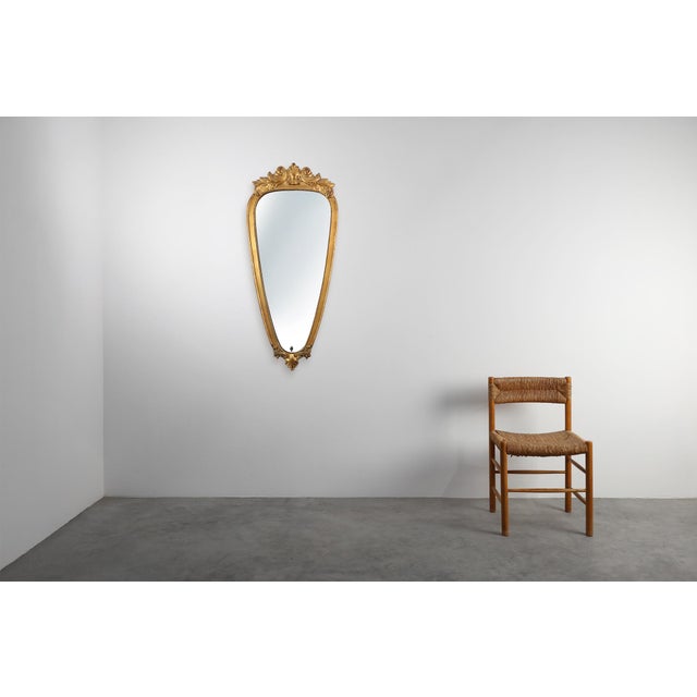 This Louis XV–style giltwood mirror, marked “VM Belgium”, is a beautifully expressive 20th‑century interpretation of the...