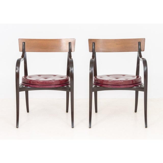 Pair of Edward Wormley for Dunbar "Alexandria" Arm Chairs, Model 6004, circa 1960, mahogany and walnut frame with burgundy...