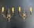 A stunning pair of 1900' s French Empire style sconces with two lights. This large pair of 2-light Empire/Directoire style...