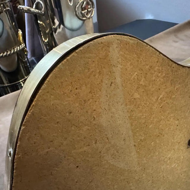 A solid brass wall mirror designed and manufactured in Italy in the manner of Gio Ponti, who used this type of mirror in...