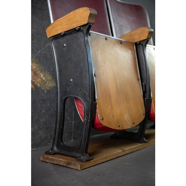 This two-seater bench comes from an old cinema and consists of a sturdy cast iron frame with wooden armrests. The seats...
