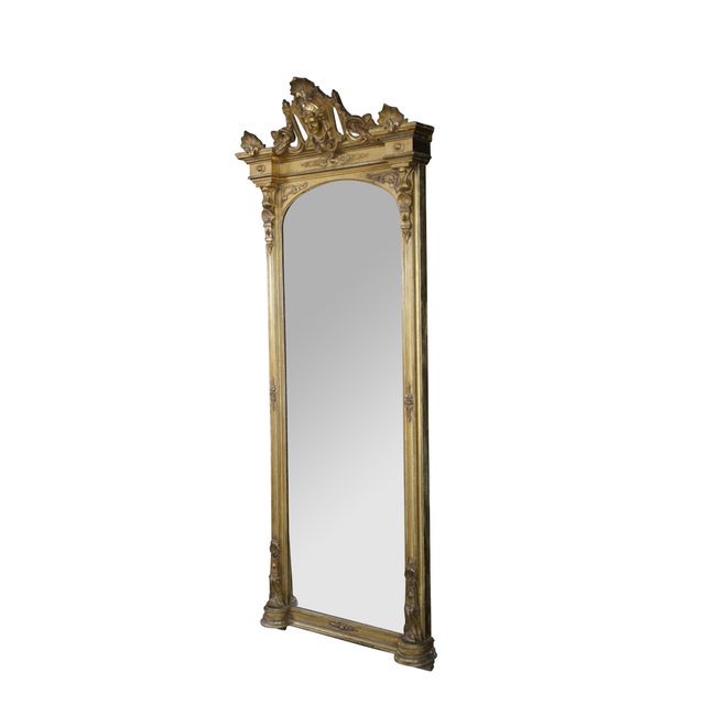 This monumental Renaissance Revival pier mirror showcases the grand architectural scale and classical vocabulary...