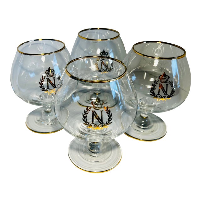 Set of four Napoleon brandy or cognac snifters. The classic Napoleon letter “N” surrounded by a classical laurel wreath....