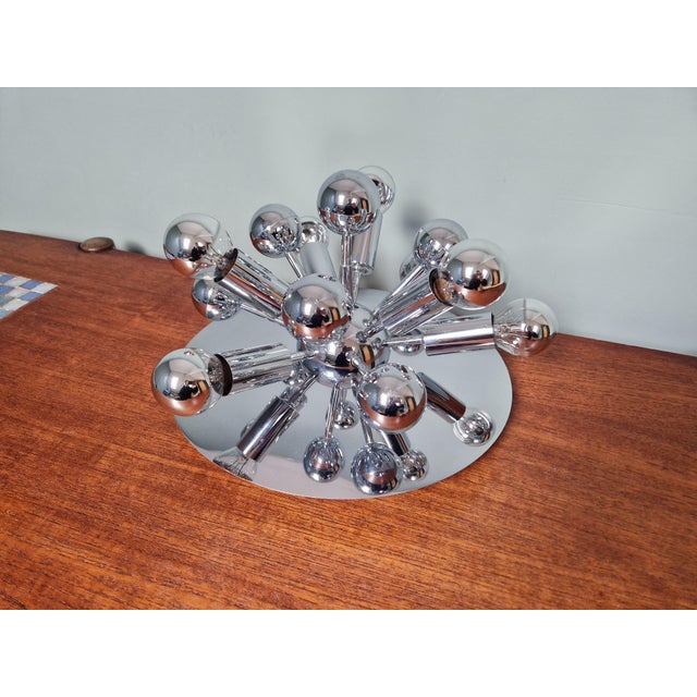Sputnik ceiling light in chrome metal, 6 light points, Space Age style from the 70s. This light can also be used as a wall...