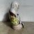 This Chinese hand painted porcelain Happy Buddha sculpture captures the joyful spirit and symbolic abundance associated...