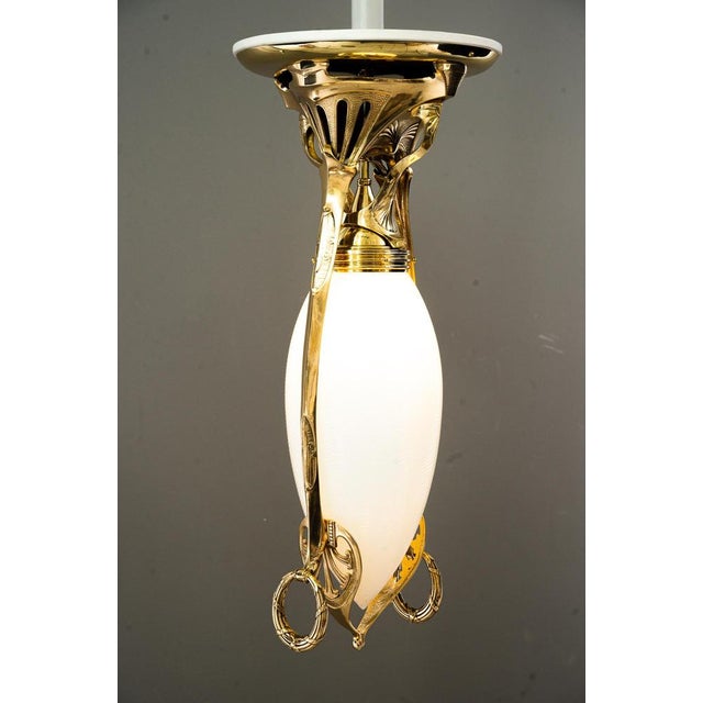 Exclusive art deco ceiling lamp, Vienna, around 1920s. Polished and stove enameled Original antique opaline glass High...