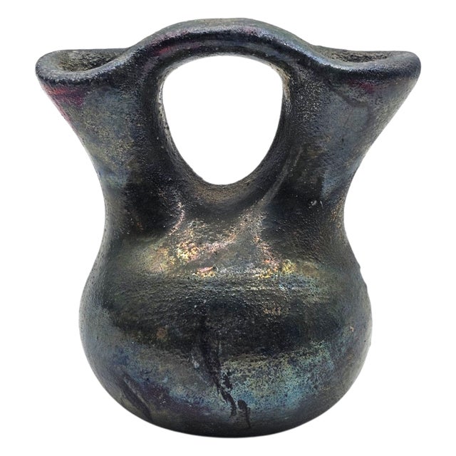 This small wedding jar is signed by Jeremy Diller and formed in the traditional double-spout profile associated with...