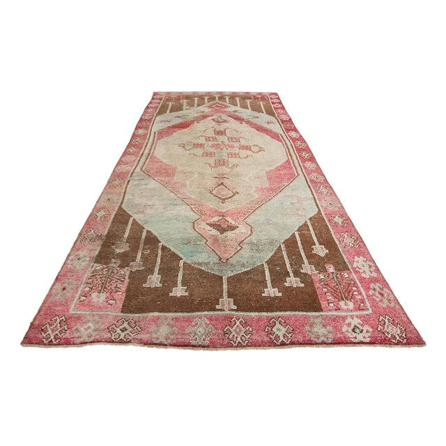 Handknotted vintage wool rug from Kars region of Turkey. Approximately 55-65 years old. In very good condition.