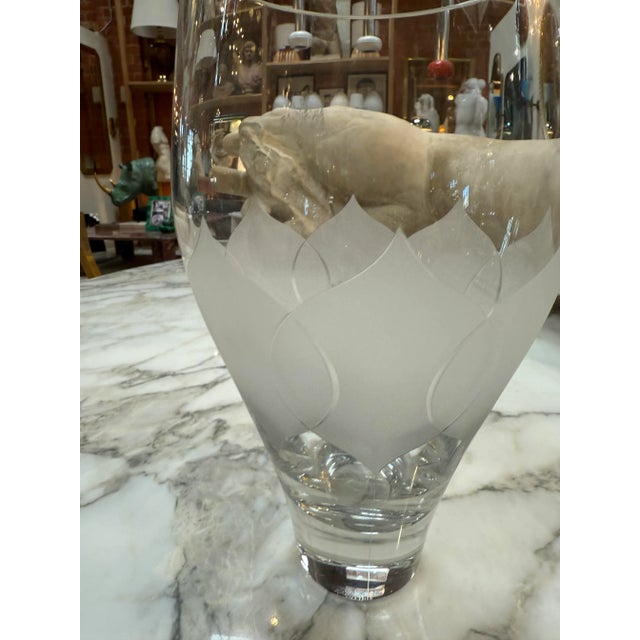 Refined clear crystal vase featuring a frosted geometric etched pattern around its midsection. The design balances clarity...