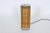 California Modern Paul Mayen for Habitat style narrow, cylinder Rattan and Wire Table Lamp. Featuring a cylindrical black...