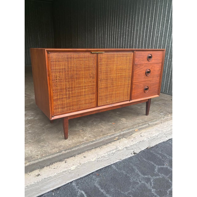 A refined and architecturally composed mid-century modern credenza designed by Jack Cartwright for Founders as part of...