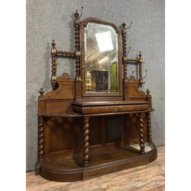 Renaissance-style oak coat rack from a château, circa 1850 Opens with a drawer in the frieze. Mirror at the top Multiple...