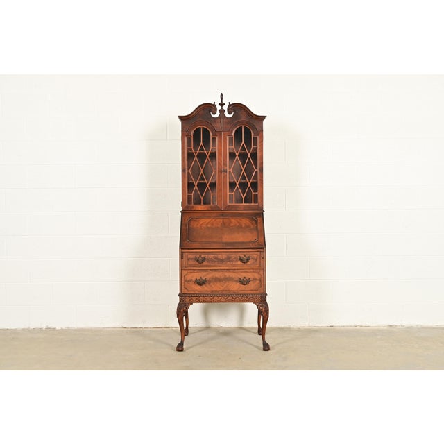 An exceptional Chippendale or Georgian style bureau with drop front secretary desk and bookcase hutch top By Saginaw...