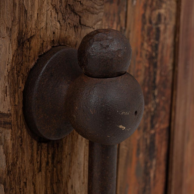 This 20th Century French industrial wooden work table showcases the raw, utilitarian character of early workshop...