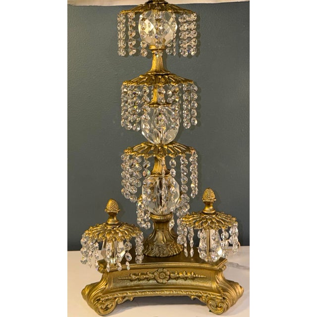 A lavish pair of vintage Loevsky & Loevsky table lamps featuring gorgeous cascading crystal drops, ornate gold-tone...