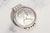A bold and substantial vintage accessory, this sterling silver money clip is centered by an impressive 1971 Bahamas $5...