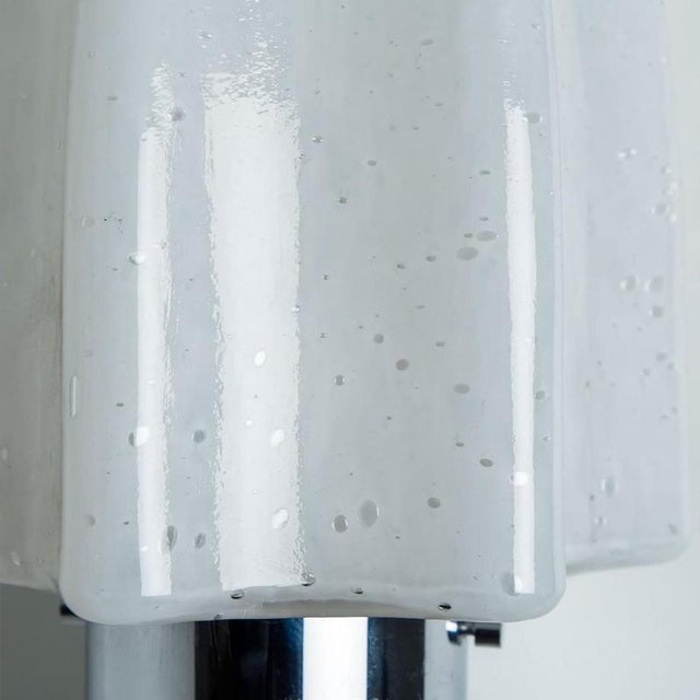 Beautiful pair of mushroom glass wall lights by doria leuchten, germany 1970s. The glass is mounted on a chrome frame....