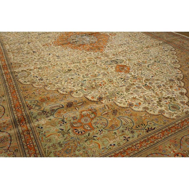 A monumental one-of-a-kind antique Tabriz rug, The piece measures approximately 13’0″ × 19’0″ (per the seller listing)....