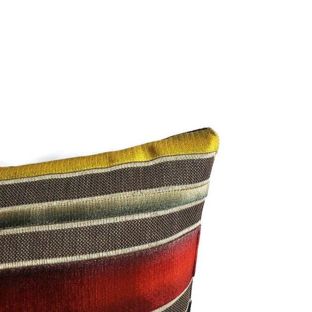 From S. Harris is Siri Stripe in the color Sanguine pillow cover. It features colors of a sunset in the cut velvet lines....
