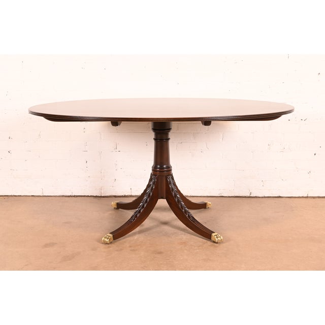 An exceptional Georgian or Regency style pedestal dining table, center table, breakfast table, or game table In the manner...