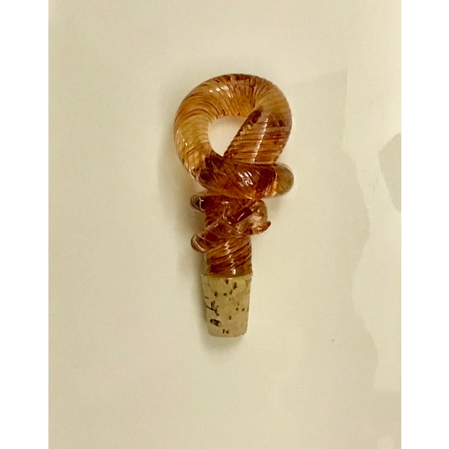 Lovely hand-blown Venetian wine/bottle stopper. Finely hand twisted design, pinkish/amber in color.