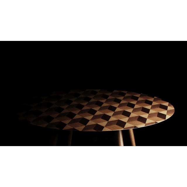 <p>The <em>Hologram</em> table's inconspicuous inlay looks ever changing depending on light and angle of view. The table...