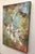 This oil on wood panel artwork features a delicate composition of white orchids contrasted against a vibrant, textured...