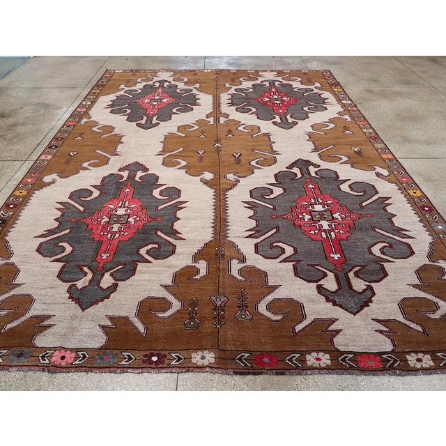 A vintage Turkish Anatolian room size carpet handmade during the Mid-20th century. Measures: 10' 2" x 13' 11"